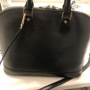 Louis Vuitton epi alma cross body purse.